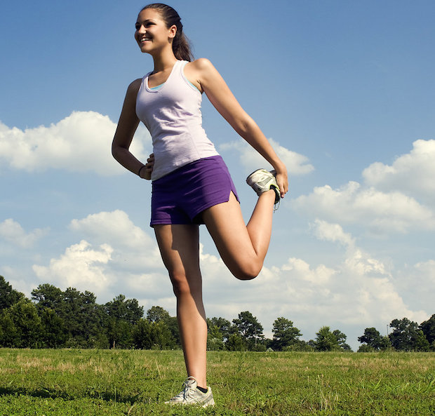 Woman stretching before doing exercise